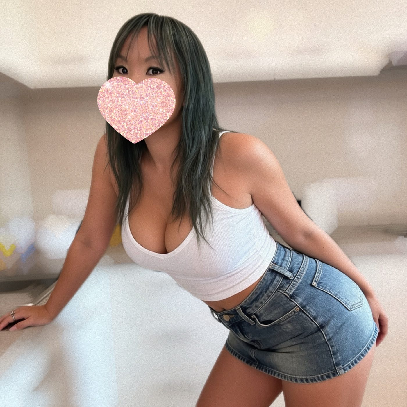 Goddess Peyton with dark green hair in a white tank